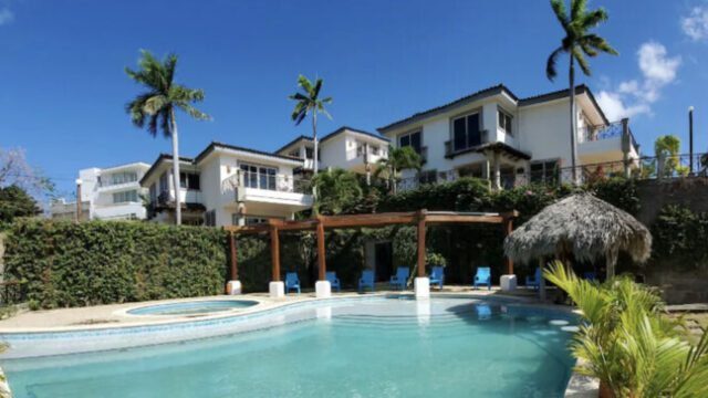 View over the pool of elegant two-story oceanview villa with private terrace and pool access at Bahía del Sol Villas & Condominiums in San Juan del Sur, Nicaragua