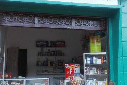 Farmacia Jireh storefront on Avenida El Abanil in San Juan del Sur, Nicaragua, offering a wide range of pharmaceutical services