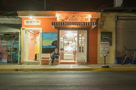 Exterior of La Fuente de Chocolate Cafe showcasing handcrafted Nicaraguan chocolates and cozy café seating in San Juan del Sur