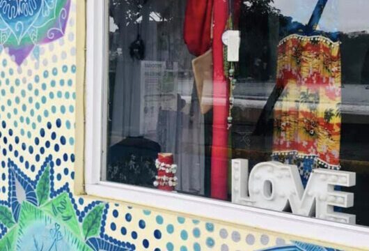 Colorful boutique display at Love in Love Clothing in San Juan del Sur, showcasing vibrant women's fashion.