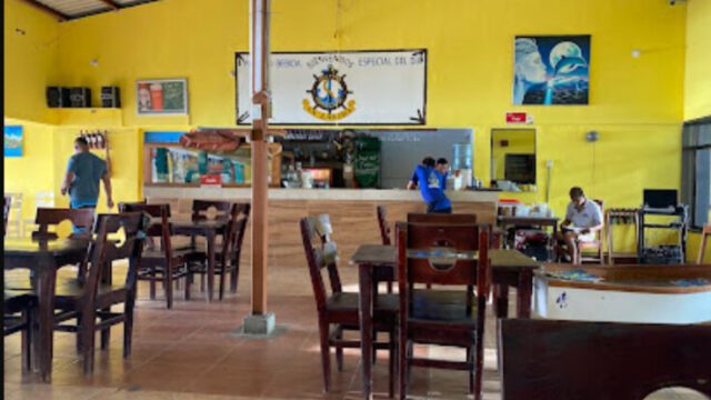 La Lancha restaurant interior with lakeside view and outdoor seating in San Juan del Sur, Nicaragua
