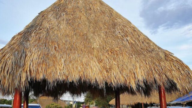 Outdoor dining area at Ranchos de San Juan del Sur featuring rustic decor and views of the surrounding landscape​