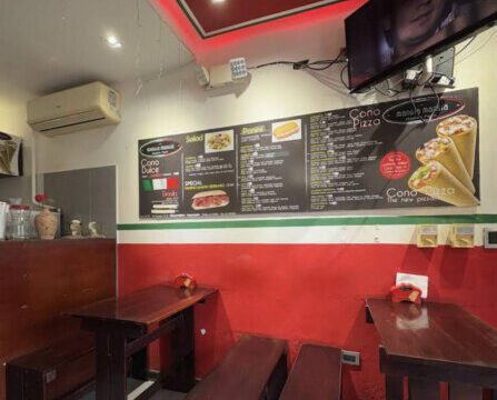 Interior view of Mangia Mangia Italian Food in San Juan del Sur, showcasing its cozy ambiance and traditional Italian decor.