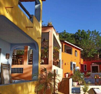 El Jardín Hotel y Restaurante in San Juan del Sur, featuring an outdoor pool with panoramic ocean views and lush tropical gardens.​