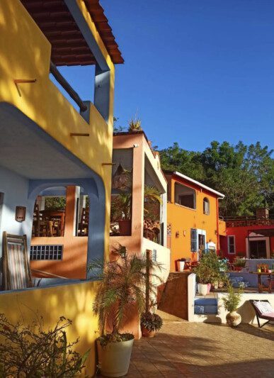 El Jardín Hotel y Restaurante in San Juan del Sur, featuring an outdoor pool with panoramic ocean views and lush tropical gardens.