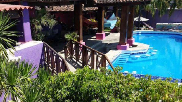 Exterior view of Rayito de Luna boutique hotel with oceanview pool and terraces in San Juan del Sur, Nicaragua