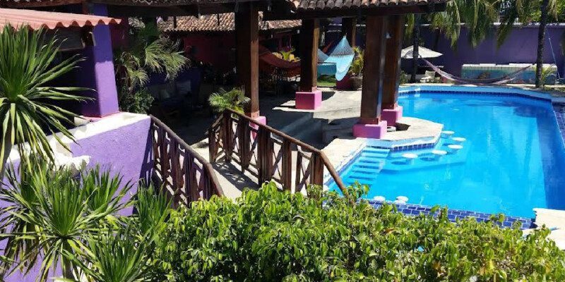 Exterior view of Rayito de Luna boutique hotel with oceanview pool and terraces in San Juan del Sur, Nicaragua