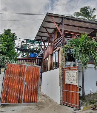 Exterior view of Nuestra Casa Boutique Bed and Breakfast with pool and terrace in San Juan del Sur, Nicaragua