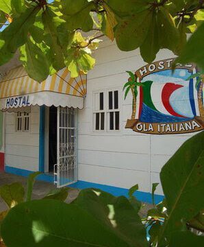 Front of the Hostal Ola Italiana building, Italian-style hostel with communal kitchen and gardens in San Juan del Sur, Nicaragua