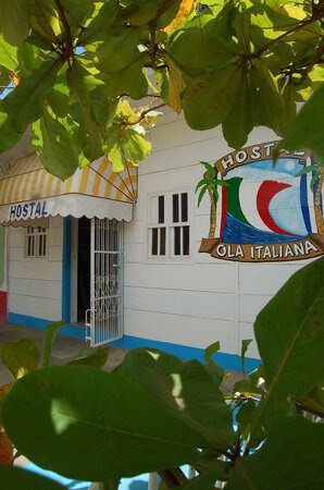Front of the Hostal Ola Italiana building, Italian-style hostel with communal kitchen and gardens in San Juan del Sur, Nicaragua