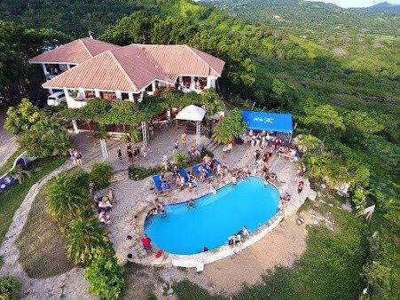 Naked Tiger Hostel's hillside pool overlooking the Pacific Ocean in San Juan del Sur, Nicaragua