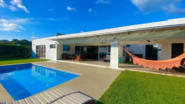 Exterior view of Casa Buenavista with private pool overlooking the Pacific Ocean and mountains in San Juan del Sur