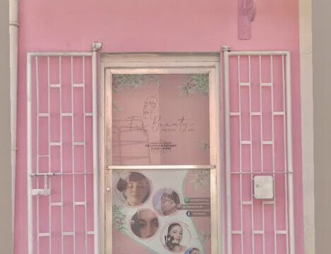 Inside view of Fer Beauty Studio showing modern styling chairs, nail stations, and hair products in a bright and stylish salon