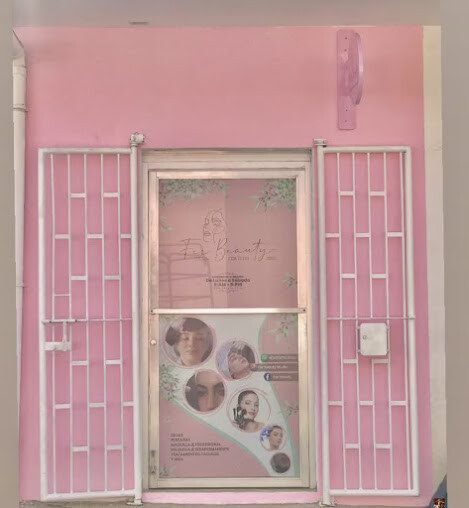 Inside view of Fer Beauty Studio showing modern styling chairs, nail stations, and hair products in a bright and stylish salon