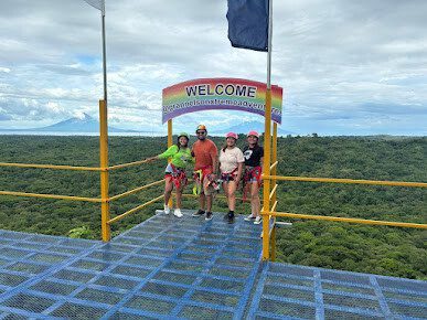 Zipline and bicycle zipline platforms overlooking forest and volcano views