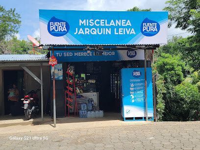 Front view of Micelanea Jarquín Leiva convenience store in San Juan del Sur with local products and snacks on display outside the entrance