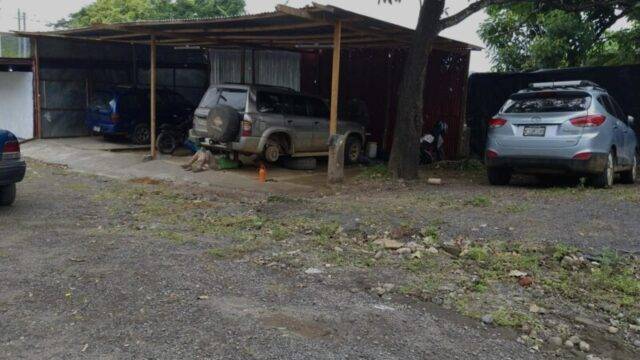 Technician servicing a car at One Stop Auto Shop SJDS in San Juan del Sur, Nicaragua