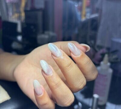 Nail Room Odaly interior showing manicure table, organized nail polish display, and cozy seating in a relaxing nail salon setting