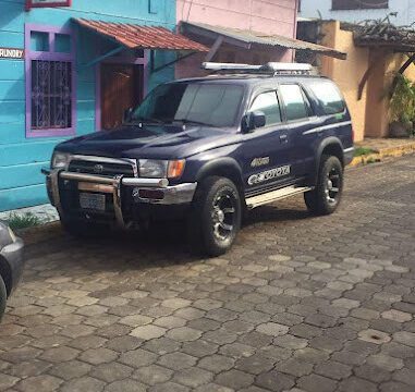 Dayanna Rent a Car & Activities white 4×4 vehicle on road in San Juan del Sur