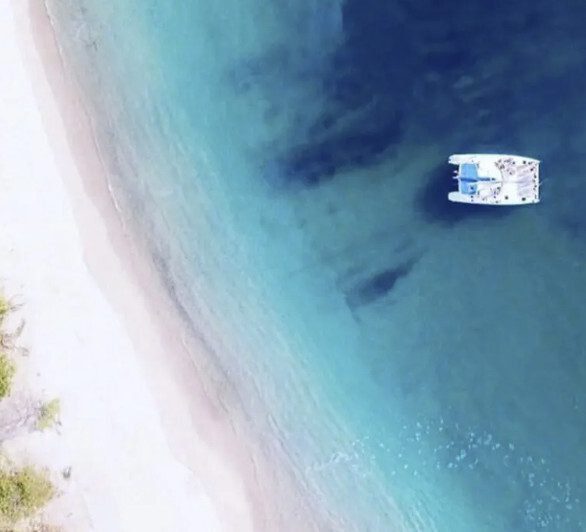 Nica Sail catamaran tour cruising along the coastline near San Juan del Sur, Nicaragua