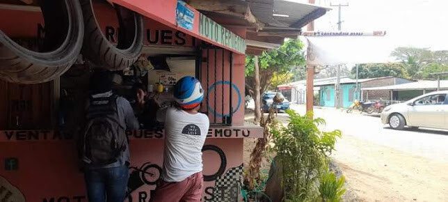 Exterior view of Moto Repuesto Los Tres Hermanos store in San Juan del Sur, Nicaragua