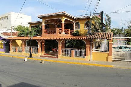 Hotel Gran Oceano with outdoor pool, lush garden, and tour options in San Juan del Sur, Nicaragua
