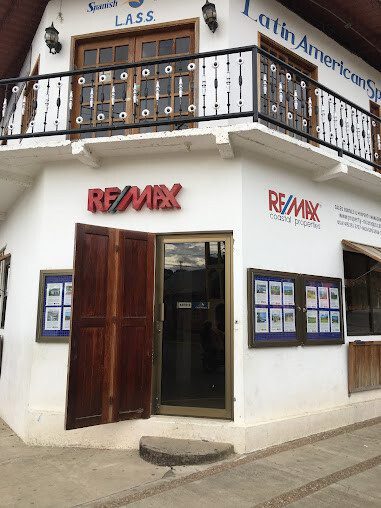 Front exterior view of the RE/MAX Coastal Properties office in SJDS