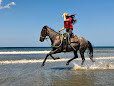 Horse and rider on a beach ride with Big Sky Stables & Ranch, Escamequita near San Juan del Sur, Nicaragua