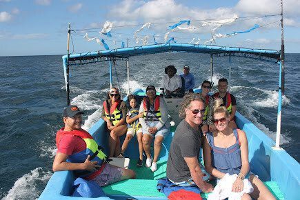 Boat full of wildlife watchers near whales off San Juan del Sur