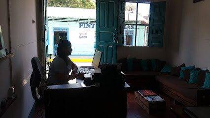 Office entrance of Nica Dream Consulting on Avenida El Tropezón, San Juan del Sur, with company signage