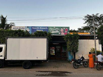 Exterior view of Minisuper Alba on Avenida El Albinal showing snack shelves, refrigerated drinks, and convenience items inside