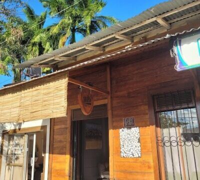 A skilled artist creating a custom design inside Ink Tattoo in San Juan Del Sur