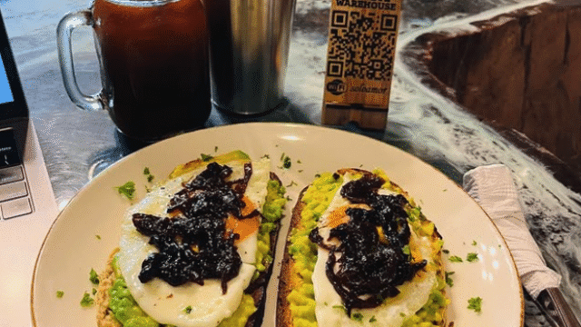 The Art Warehouse Escamequita image of a smashed avocado on toast