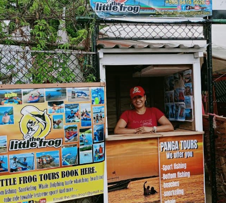 Little Frog Tours image of stall with worker in red