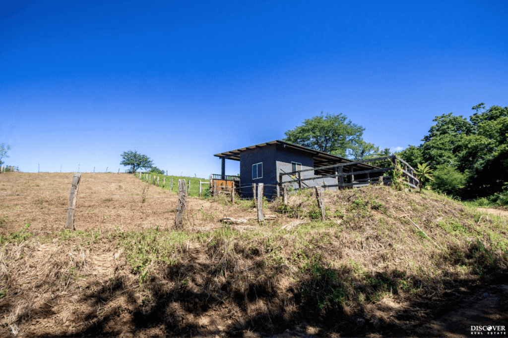 Low Angle view of stables belonging to Equestrian Estate with new 3-bedroom home with 2 bedroom casita with pool listed by Discover Real Estate