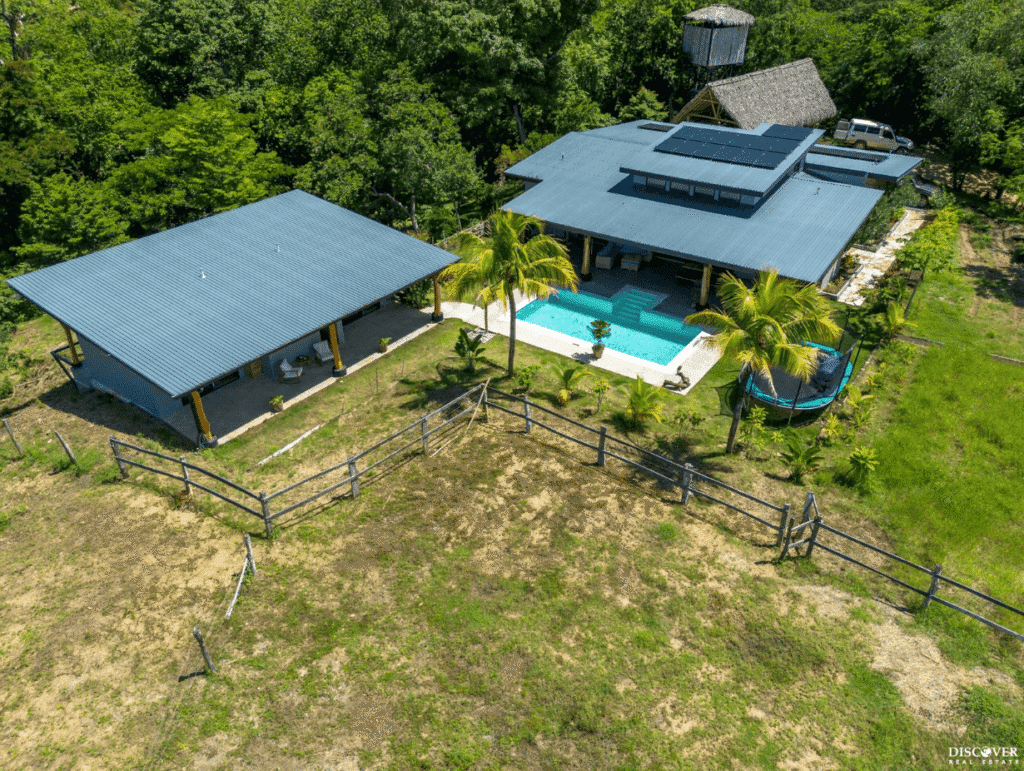 View from above of Equestrian Estate with new 3-bedroom home with 2 bedroom casita with pool listed by Discover Real Estate
