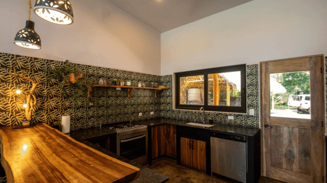 View 2 of Close up view of breakfast bar into kitchen area of main house of the equestrian estate listed by Discover Real Estate
