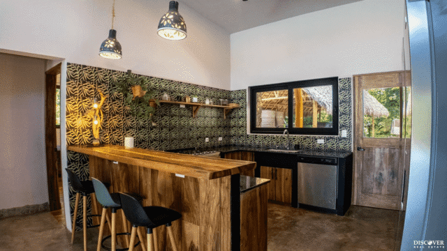 View over breakfast bar area into kitchen of main house of the equestrian estate listed by Discover Real Estate