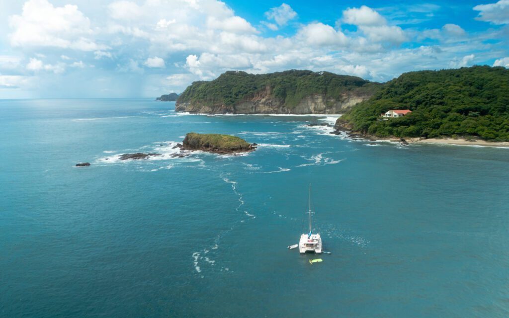 Shot of Santana Sail Yacht with Island Ahead
