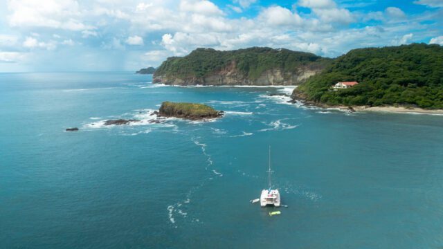 Shot of Santana Sail Yacht with Island Ahead