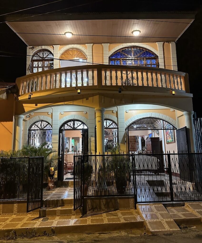 Photo of exterior of the Granados Guest House at night